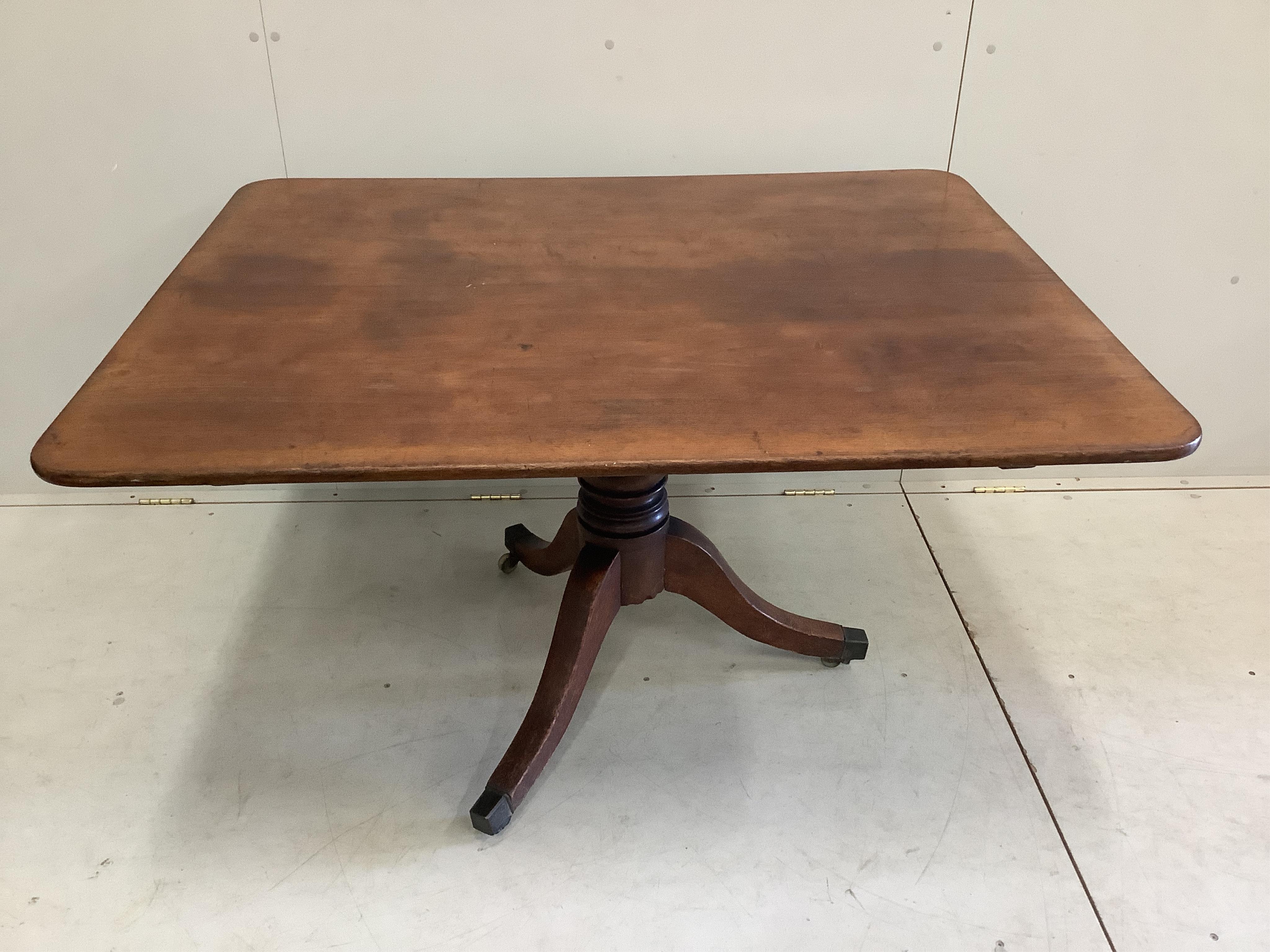 A Regency rectangular mahogany tilt top dining table, width 121cm, depth 97cm, height 70cm. Condition - fair